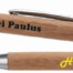Zwei Geschenkpapier-Rollen "Zimmerer": eine mit schwarzem "Zimmerei Paulus", eine mit gelbem "Holzbau Maier" Motiv bedruckt. Wertica Shop